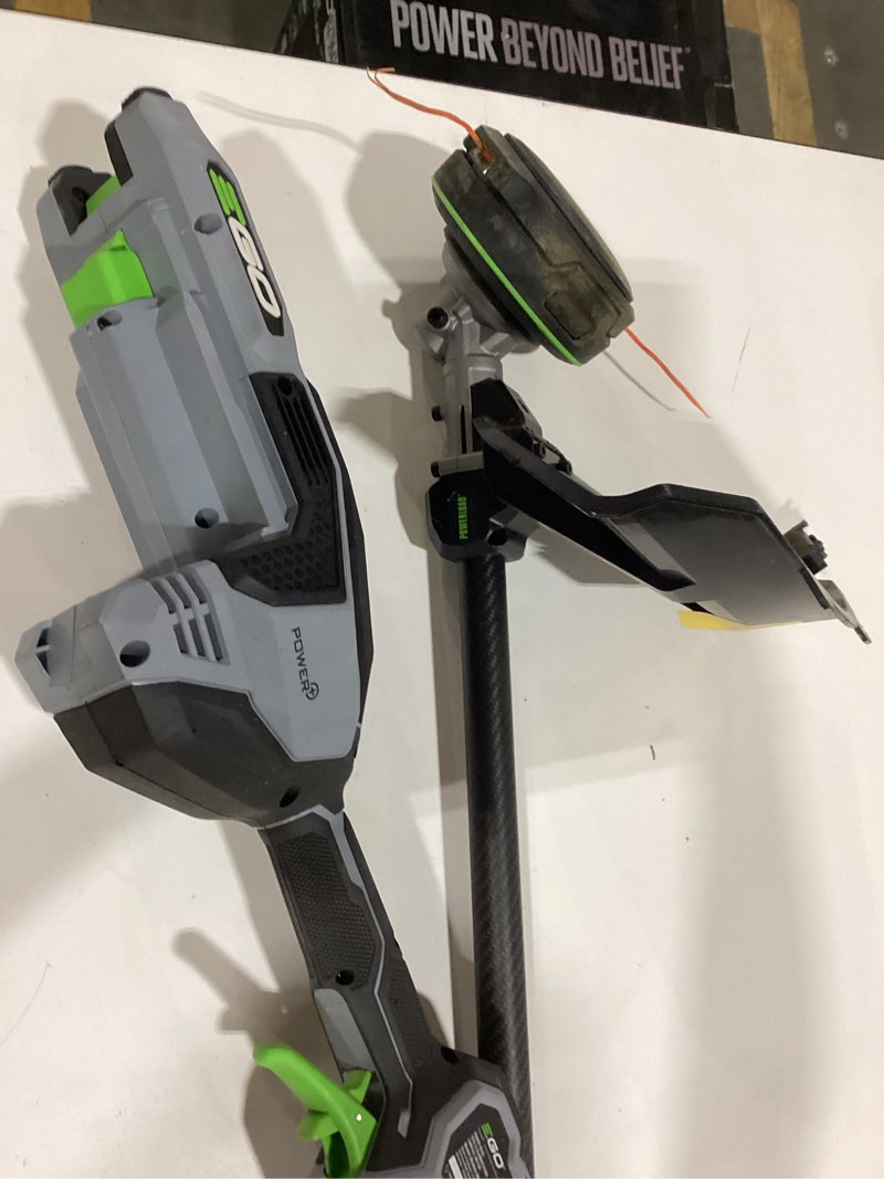 Condition photo showing As Is for cordless commercial series string trimmer no charger included