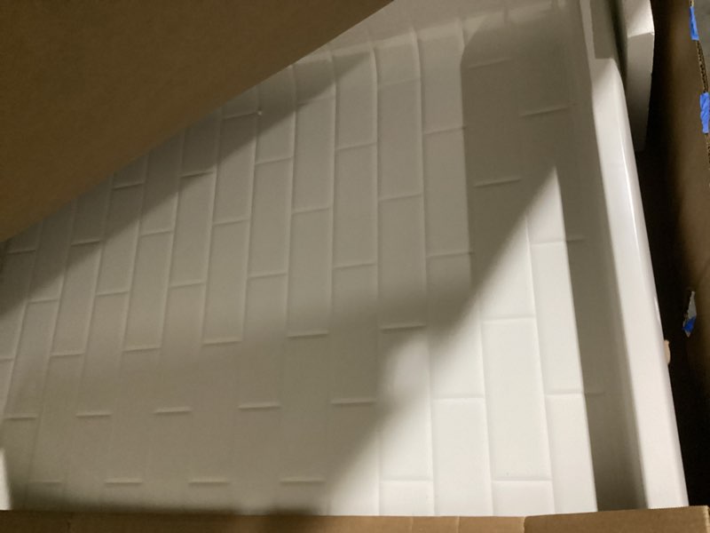 Condition photo showing As Is for sterling traverse 60-in w x 4.75-in d x 73.63-in h white direct to stud alcove shower back wall panel