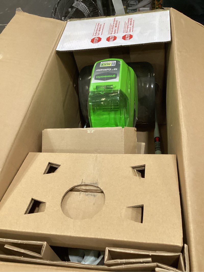 Condition photo showing As Is for greenworks 40v 10" cordless tiller / cultivator, 4.0ah battery and charger included, green 4ah battery and charger soil tiller cultivator