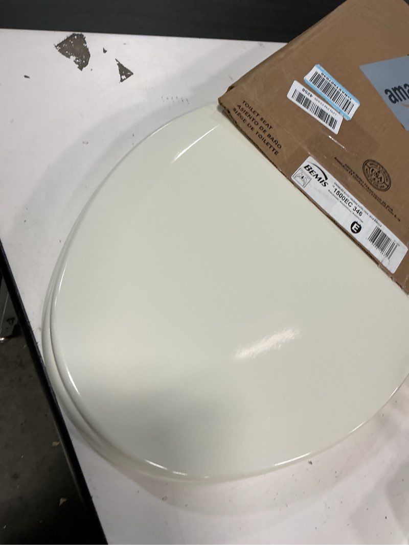 Condition photo showing As Is for Bemis Elongated Enameled Wood Toilet Seat in Biscuit with Easy•Clean? Hinge