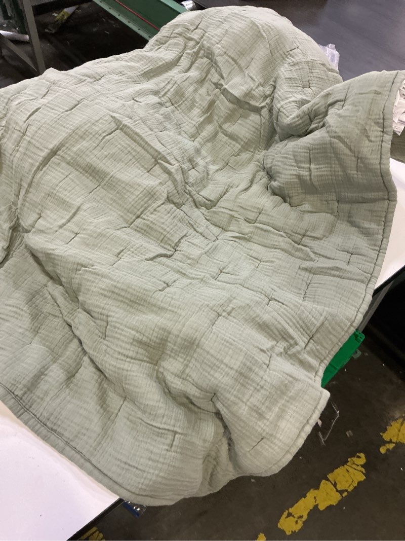 Condition photo showing As Is for organic airy gauze blanket size 36in x50in green