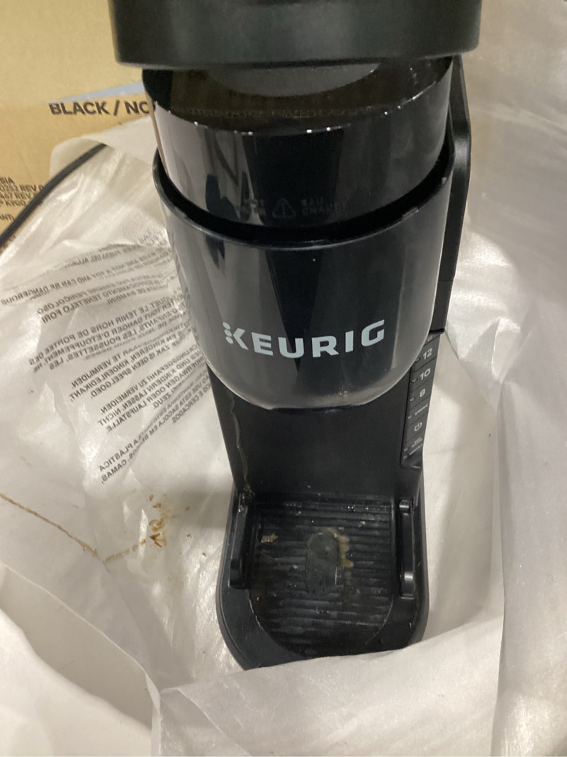 Condition photo showing As Is for Used damaged Keurig K-Slim Single Serve K-Cup Pod Coffee Maker, Multistream Technology, 3 Brew Sizes, Slim and Sleek Design, 46oz Removable Reservoir, Black