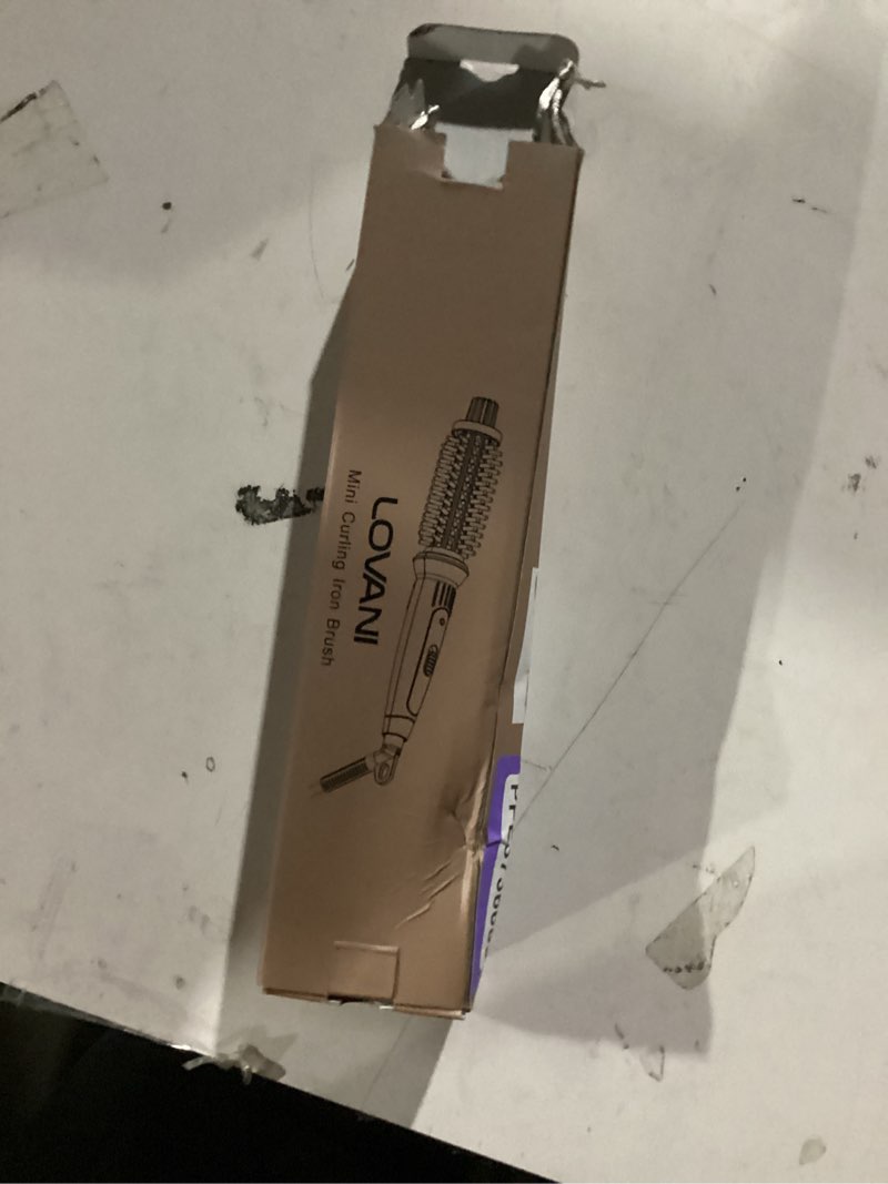 Condition photo showing New/Like New for LOVANI Mini Travel Curling Iron Brush 3/4 Inch, Small Curling Brush for Short Hair, Bangs & Fine Hair, Portable Anti-Scald Hot Curler, Dual Voltage with Travel Bag