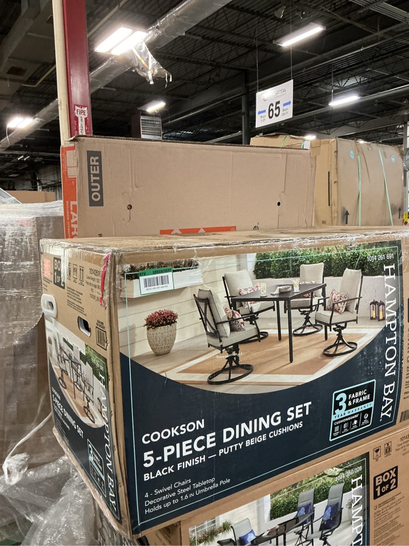 Condition photo showing New/Like New for cookson black swivel metal outdoor dining chair with beige cushions (4-pack)