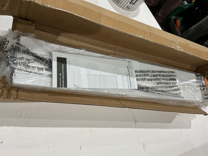 Condition photo showing As Is for allen + roth 22.5-in x 64-in white light filtering cordless cellular shade