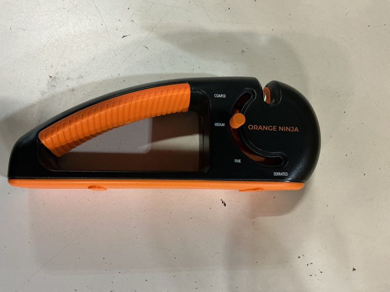 Condition photo showing New/Like New for orange ninja 4-stage knife sharpener & serrated knife sharpener– repairs, sharpens & polishes blades with ergonomic non-slip grip