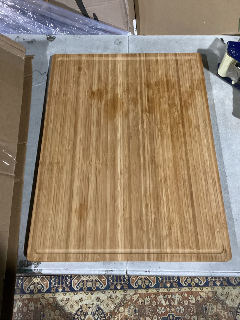 Condition photo showing As Is for 24"x18" Bamboo Cutting Boards, XXL Charcuterie Cheese Platter Serving Tray with Handles and Juice Grooves, Solid Structure, Slim, Durable, Reversible 24"L x 18"W Carbonized