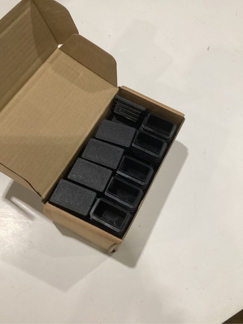 Condition photo showing As Is for uxcell 32 pcs rectangle tubing end caps 1 1/2 x 1 inch plastic hole plugs insert end cap for metal tubing post chair leg table bookshelves furniture, black 1 1/2 x 1 inch 32