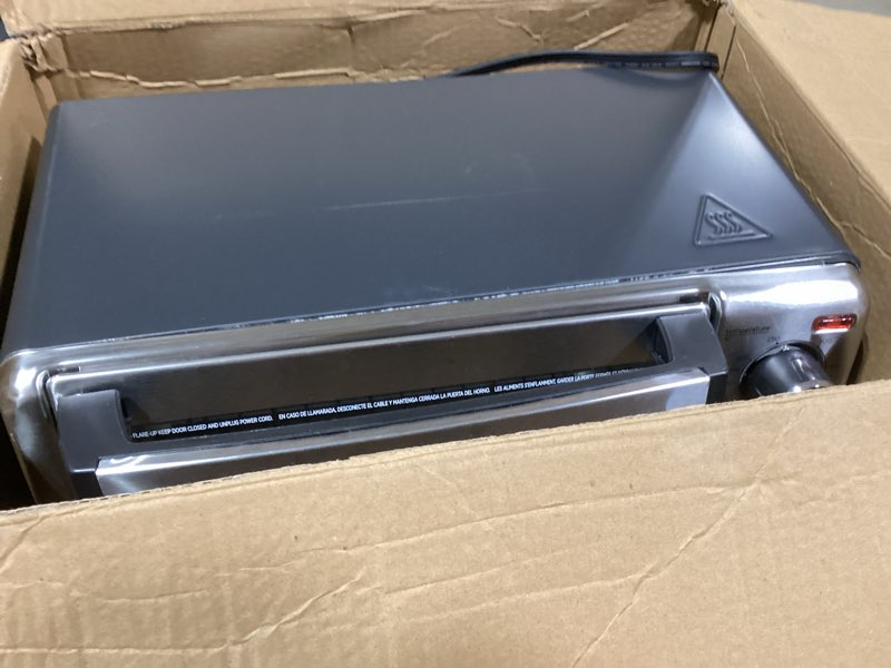 Condition photo showing As Is for BLACK+DECKER 4-Slice Convection Oven, Stainless Steel, Curved Interior Fits a 9 inch Pizza, TO1313SBD