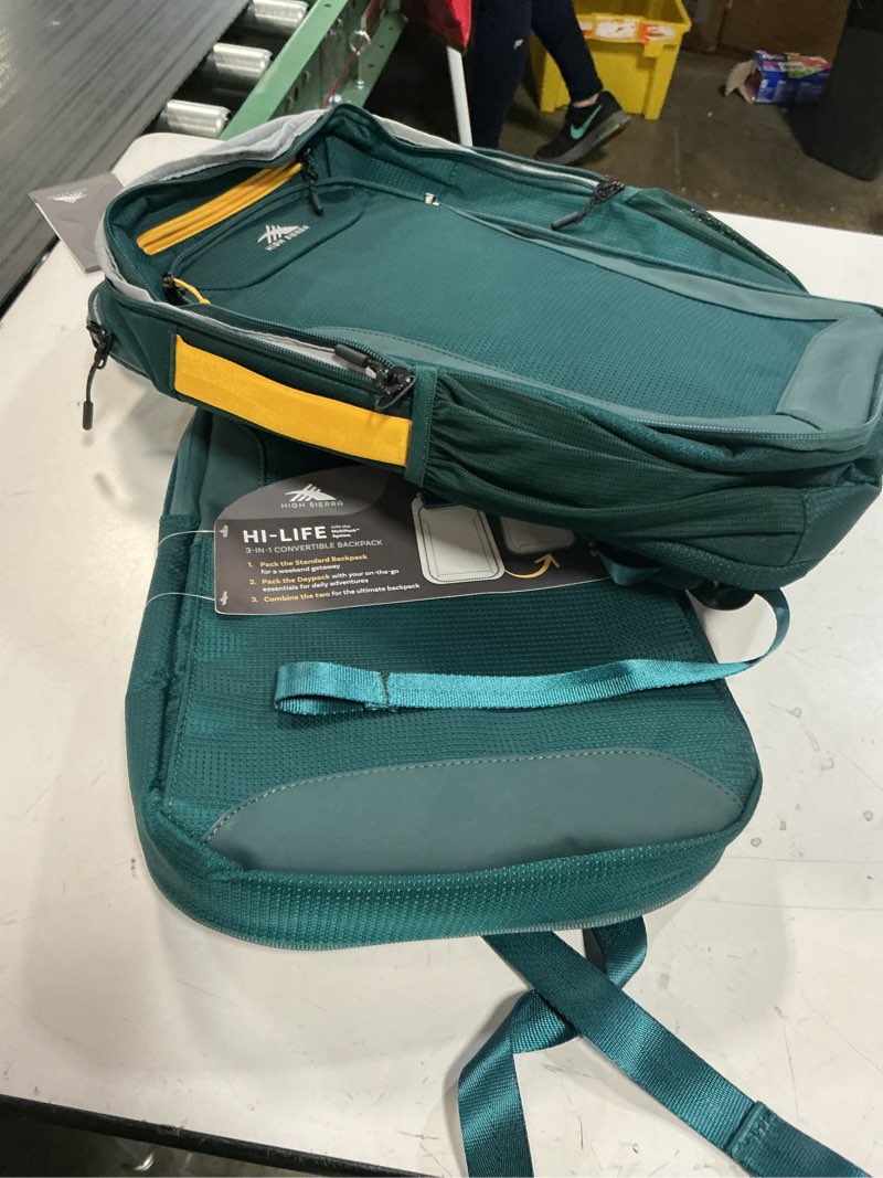 Condition photo showing Good Condition for high sierra hi-life 3-in-1 convertible backpack - features removable daypack, stack-it strap, adjustable sternum strap, fleeced pocket for scratch protection, dual water bottle pockets - green/yellow 3-in-1 convertible green/yellow