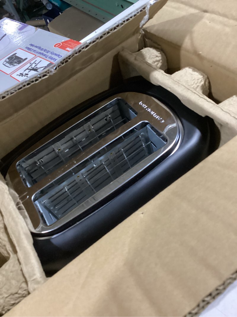 Condition photo showing Good Condition for amazon basics 2 slice toaster, with 6 browning settings, extra wide slots for bagels and special breads, removable easy-to-clean crumb tray, cancel/defrost/bagel buttons, 900w, black & silver 2 slice silver front