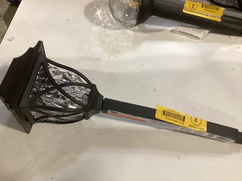 Condition photo showing As Is for 10k+ bought last week harbor breeze 10 -lumens black solar led outdoor path light with dusk-to-dawn sensor