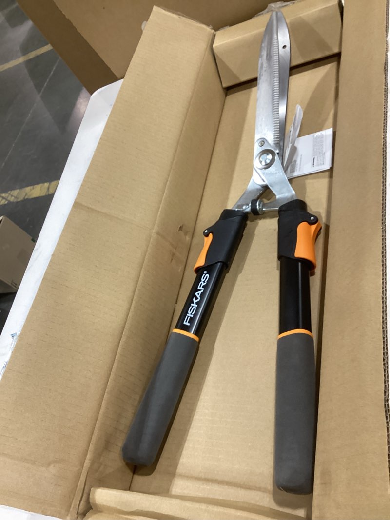 Condition photo showing New/Like New for fiskars power-lever extendable hedge shears, self-sharpening serrated steel blades for clean cuts, handles adjust 25"-33" for high reach, multiplies leverage for 2x power, 10" blades, orange/black 25-33" power-lever