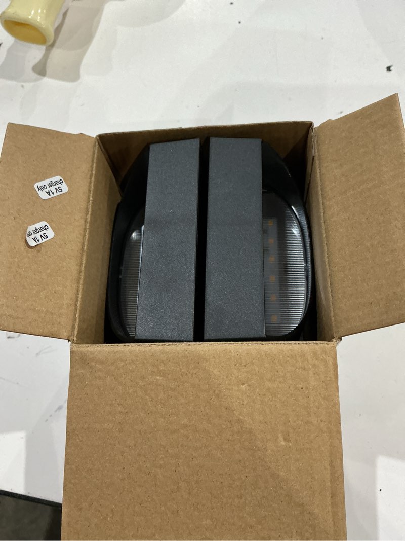 Condition photo showing As Is for utilitech 2-pack 4-in black rechargeable motion activated led wall sconces