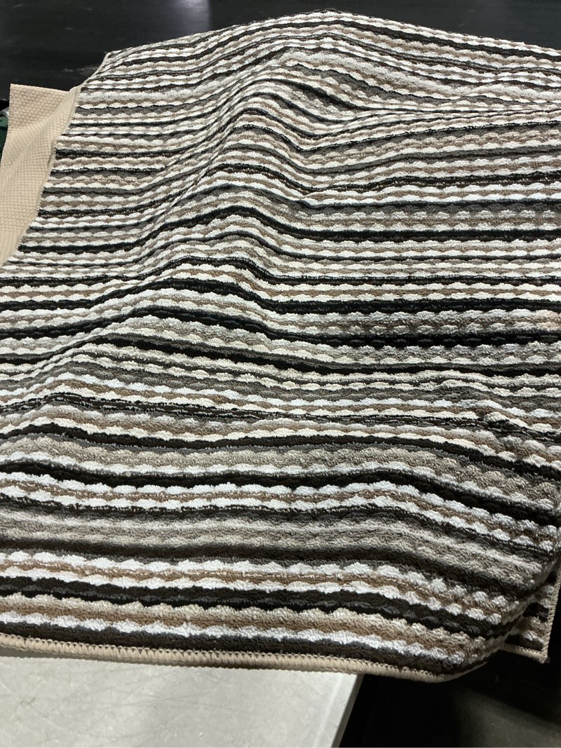 Condition photo showing As Is for (unknown measurement)(garland rug carnival  tufted polypropylene assorted earth tones rectangular