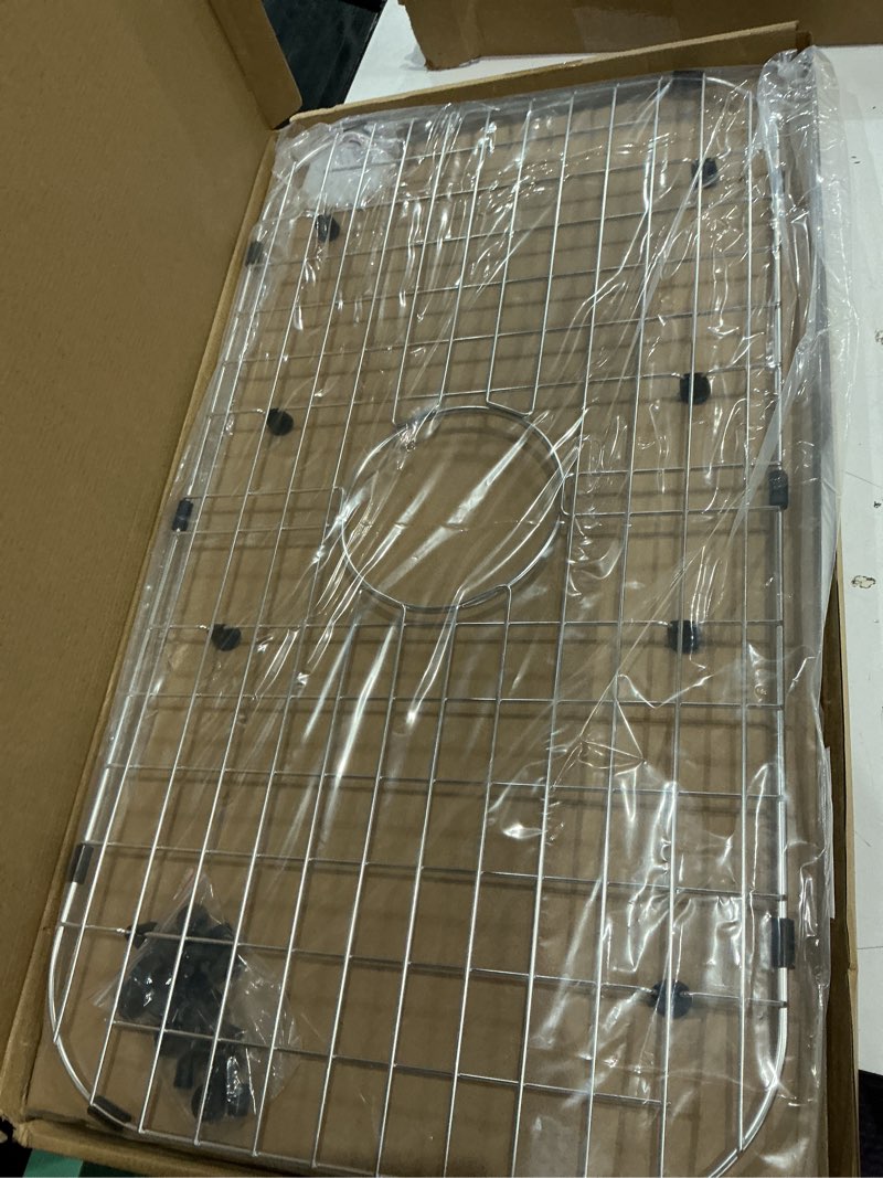 Condition photo showing Good Condition for serene valley sink protector grid 26-1/16" x 14-1/16", centered drain with corner radius 3-1/2", 304 stainless steel material nlw2614c