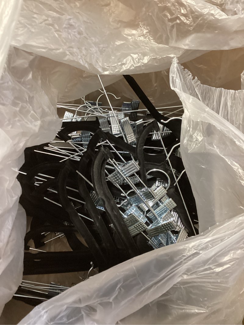 Condition photo showing Good Condition for amazon basics velvet non-slip skirt clothes hangers with clips, 360 degree rotatable hook, sturdy construction, organize pants and skirts, black/silver