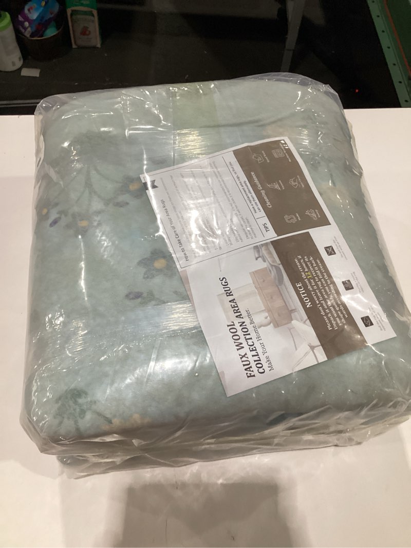 Condition photo showing New/Like New for YIHOUSE BLUE Floral Washable Area Rug 5'x7'- Small Colorful Living Room Rug Ultra-Thin Non-Slip Area Rug for Bedroom, Nursery Room, Kids Room (Orange, 5x7ft)  BLUE 5' x 7' (Rectangular), SIMILAR TO STOCK PHOTOS, NOT EXACT, BLUE