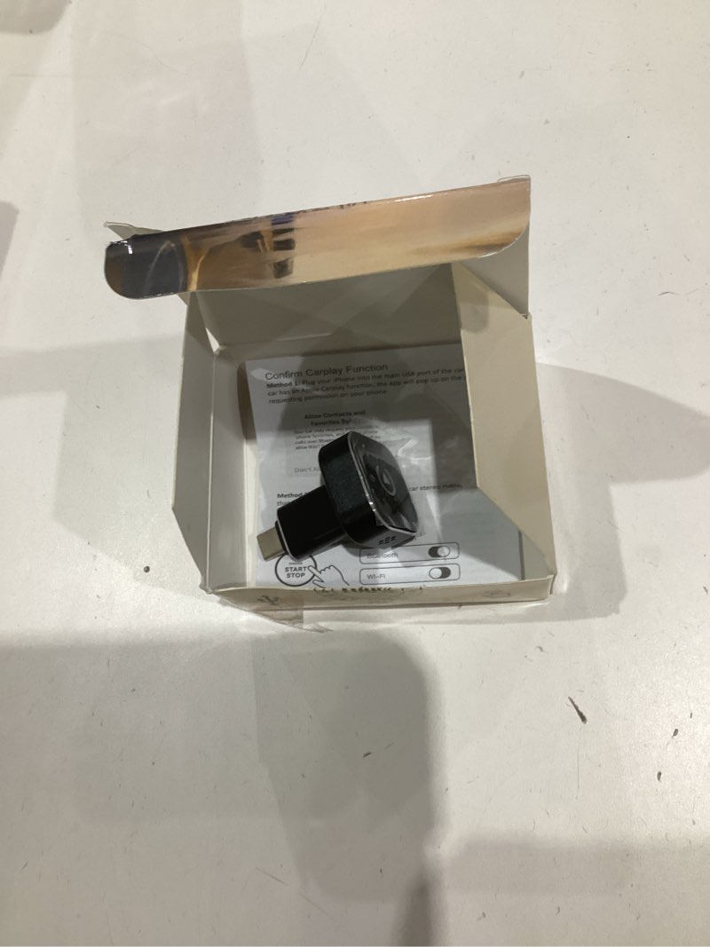 Condition photo showing As Is for wireless carplay adapter, 2026 upgraded wired to wireless for apple carplay & android auto, mini usb design car play adapter with type-c extension, plug and play, stable connection & no latency white