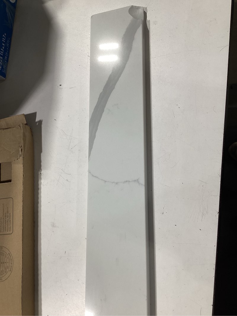 Condition photo showing As Is for allen + roth calacatta quartz 4-in h x 21.25-in l white quartz bathroom side splash