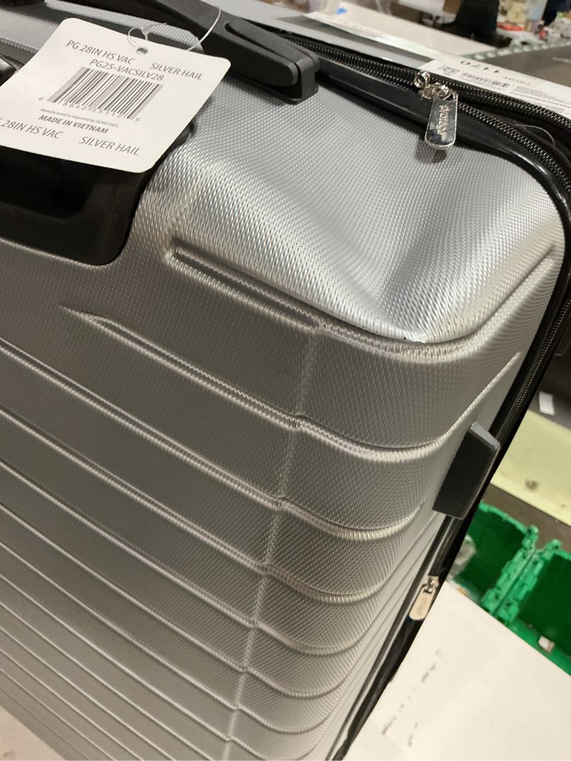 Condition photo showing As Is for protege vacationer 28-inch checked expandable hardside luggage with 360-spinner wheels and divider pockets, silver