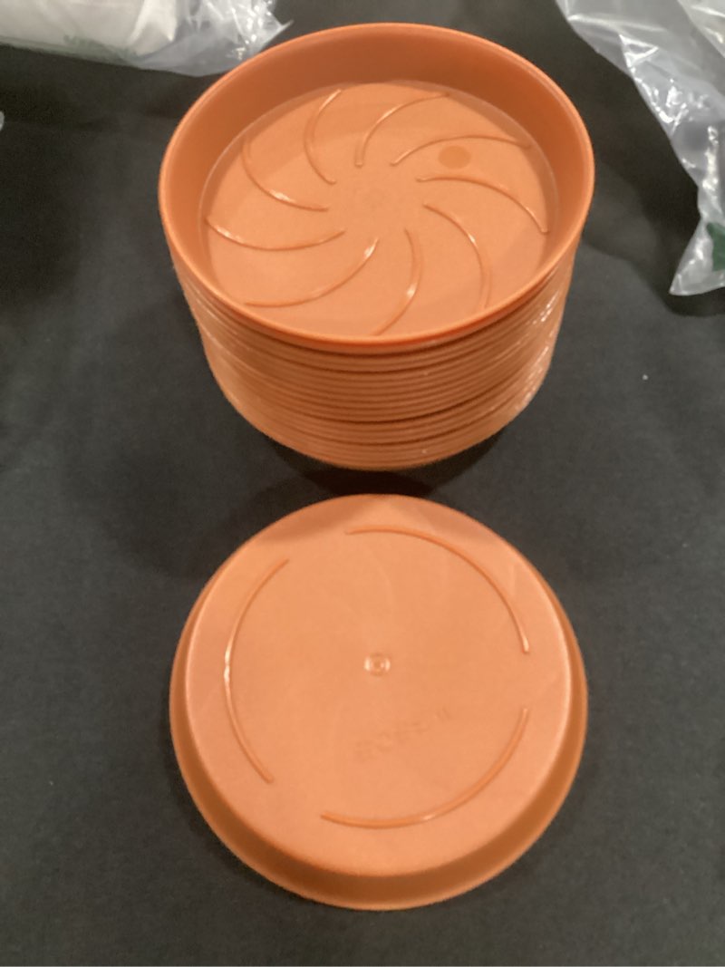 Condition photo showing Good Condition for (qty 19) 5” planter trays terra cotta color plastic 