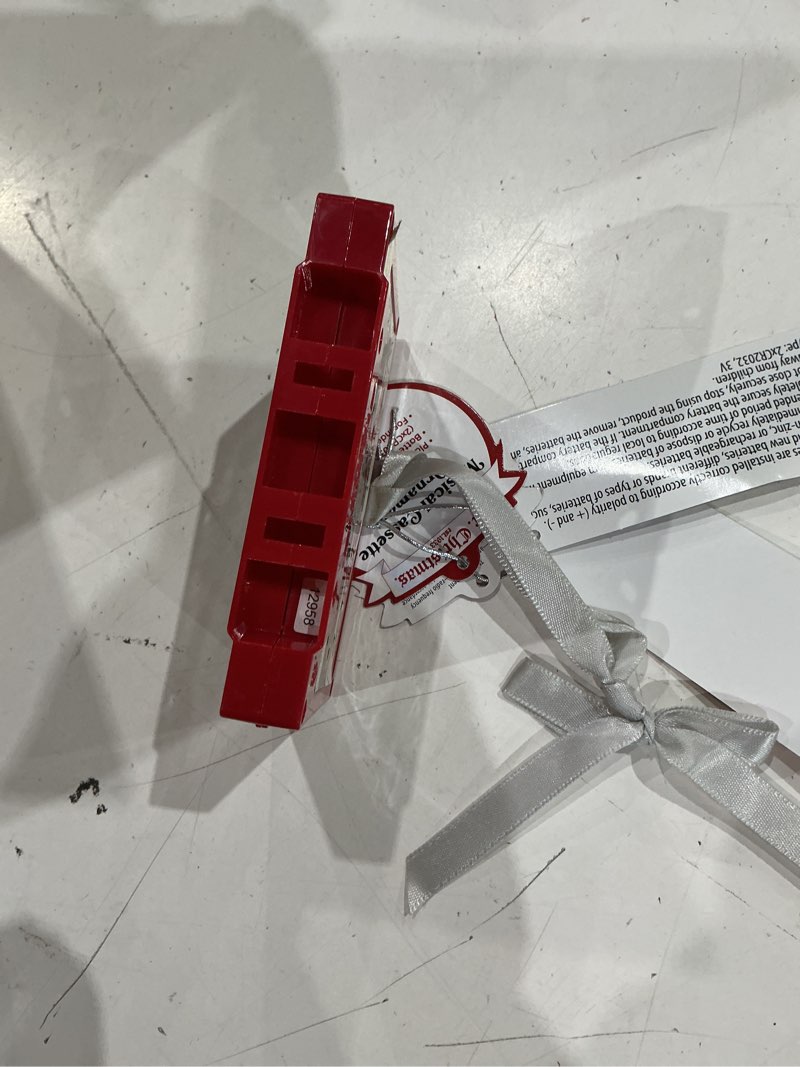 Condition photo showing As Is for mr. christmas retro cassette ornament  red