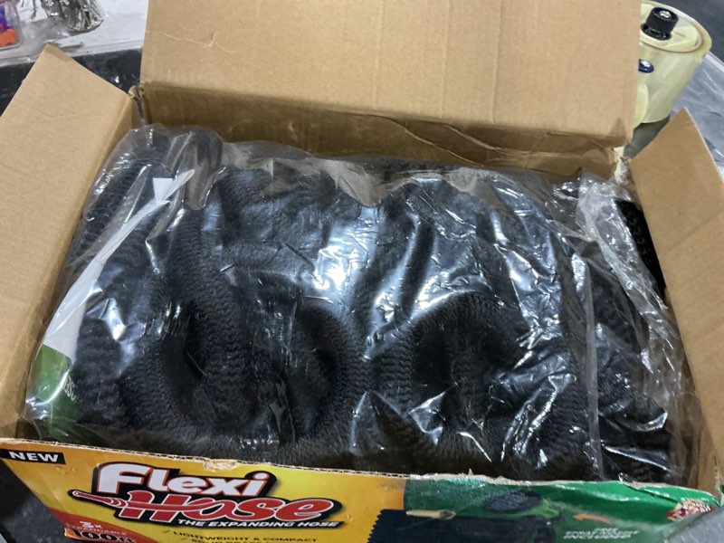 Condition photo showing New/Like New for flexi hose expandable garden hose with 8 function nozzle, 100ft - lightweight retractable garden hose, water hose - no-kink flexibility, 3/4 inch solid brass fittings and double latex core 100ft black