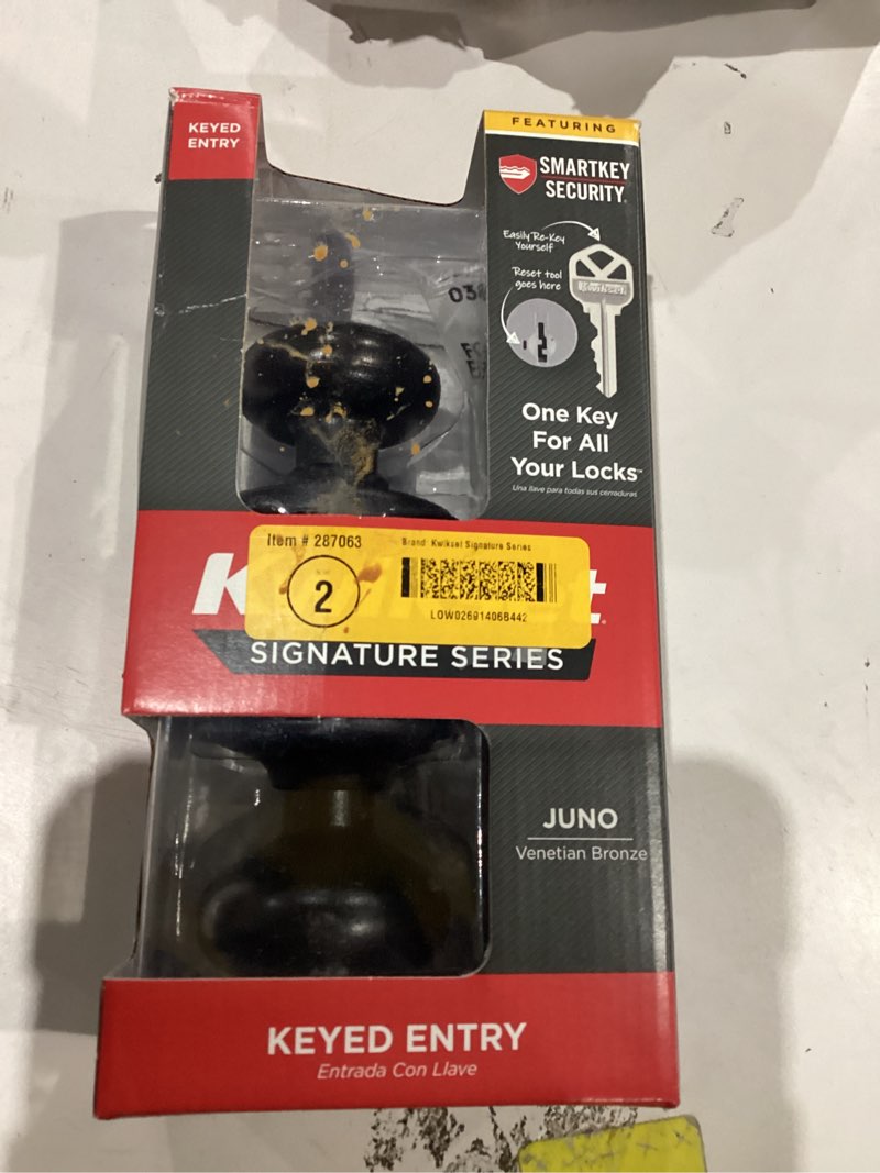 Condition photo showing As Is for kwikset juno entry door knob with lock and key, secure keyed handle exterior, front entrance and bedroom, venetian bronze, pick resistant smartkey rekey security and microban