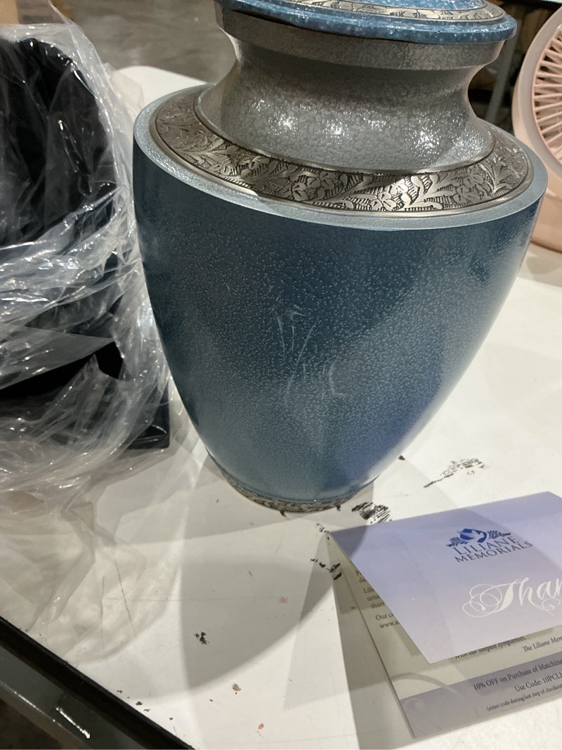 Condition photo showing As Is for handcrafted metal memorial urns for funeral homes