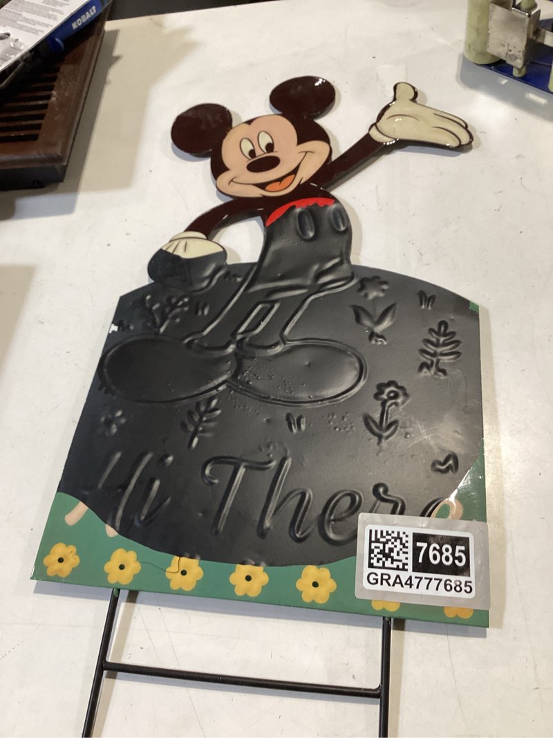 Condition photo showing As Is for disney 26-in multiple colors/finishes metal sign