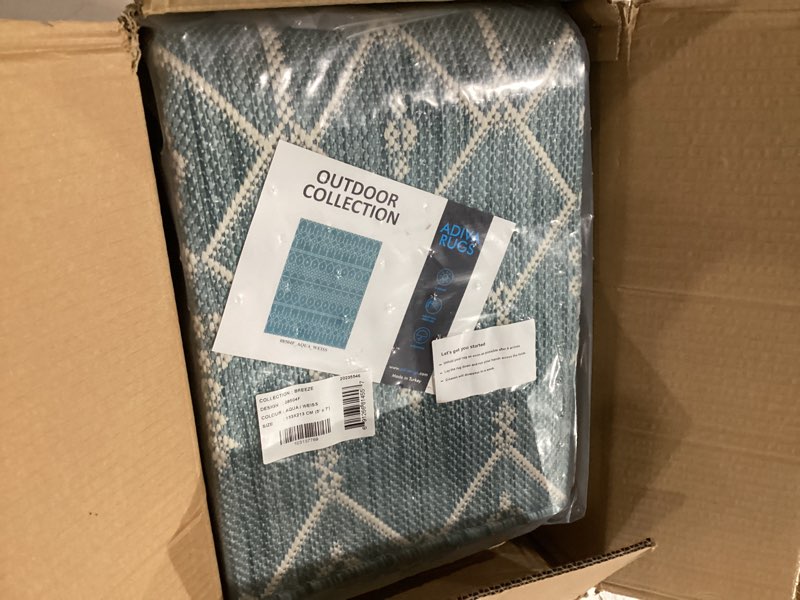 Condition photo showing New/Like New for adiva rugs outdoor indoor area rug, weather resistant, easy to clean, stain resistant floor mat for dining room, backyard, deck, patio (aqua weiss, 5' x 7') aqua weiss 8504a 5' x 7' (rectangular)