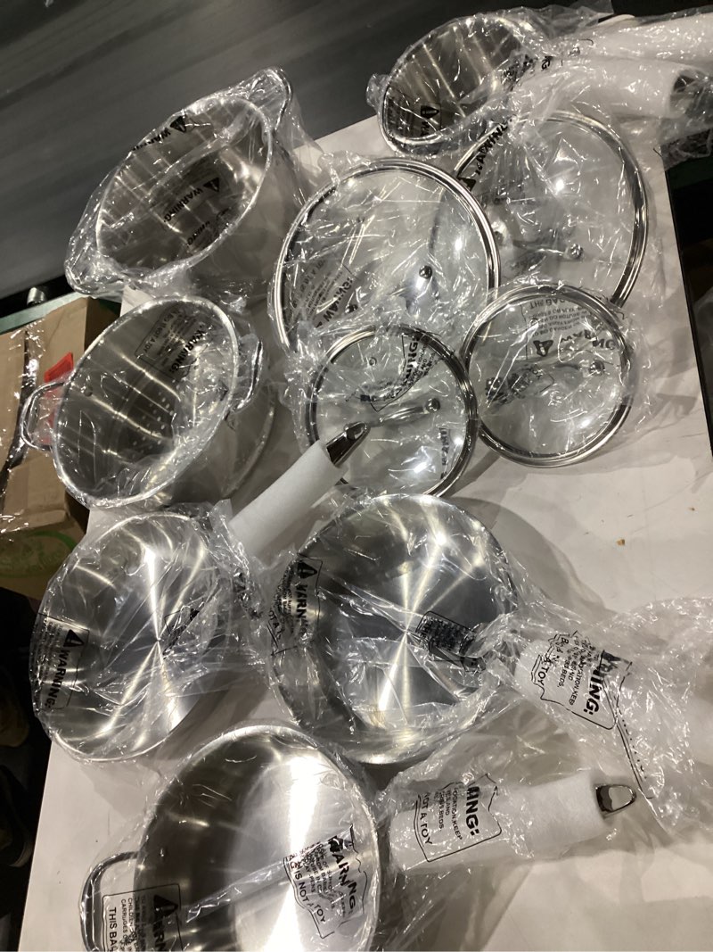 Condition photo showing New/Like New for 3 ply stainless steel 11-piece cookware set with lids, pots and pans kitchen set, non-toxic, induction, oven, dishwasher safe, professional chef quality 11 pieces