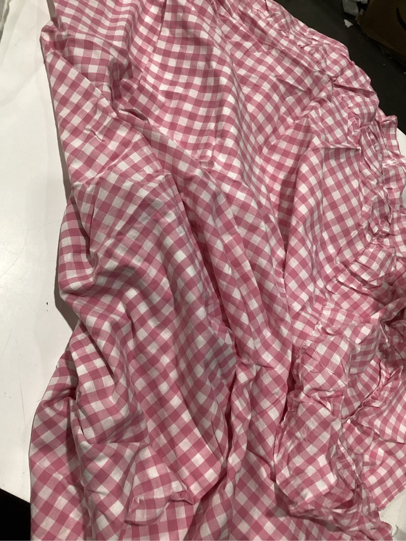 Condition photo showing As Is for pink ruffle edge picnic table cloth