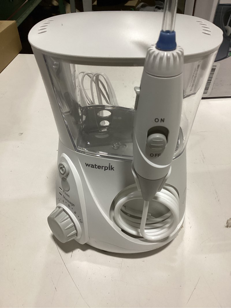 Condition photo showing New/Like New for Waterpik Aquarius Water Flosser For Teeth Cleaning, Gums, Braces, Dental Care, Electric Power With 10 Settings, 7 Tips For Multiple Users And Needs, ADA Accepted, White WP-660, Packaging May Vary
