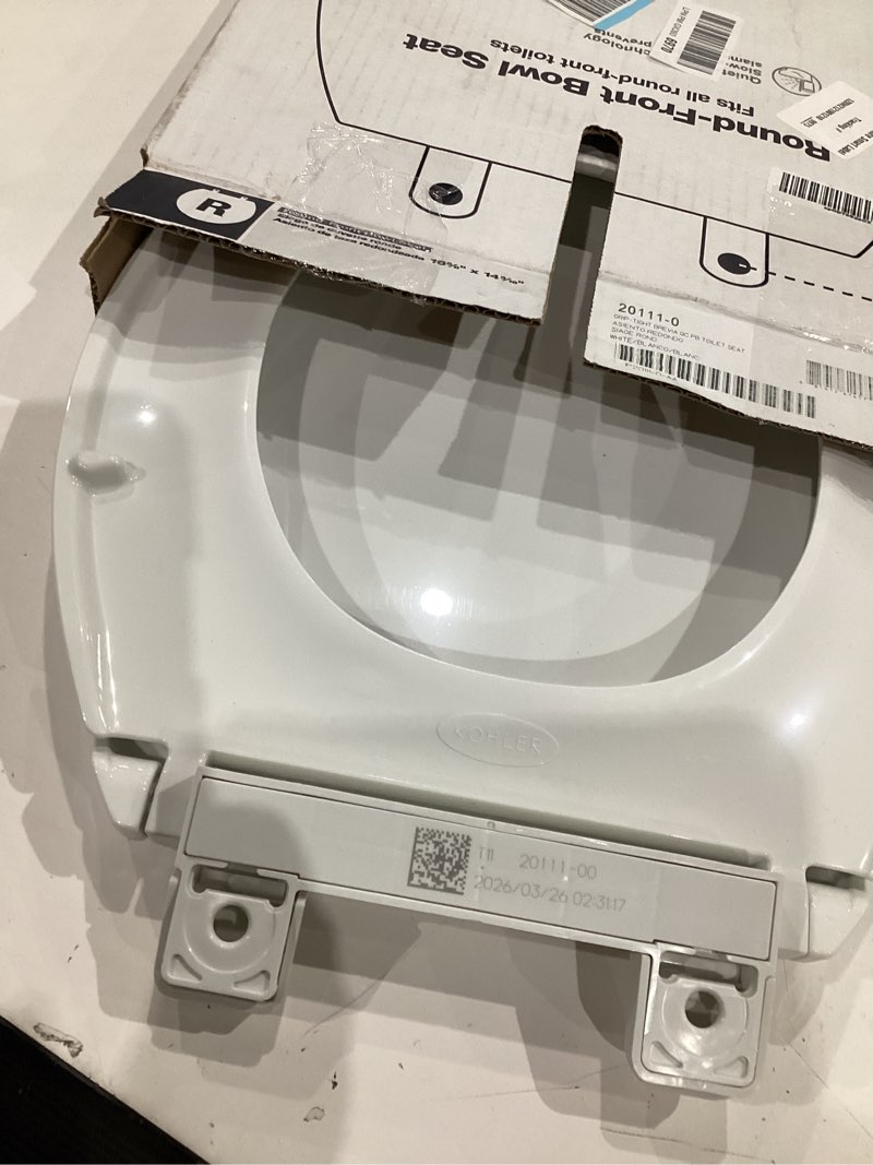 Condition photo showing As Is for kohler 20111-0 brevia, slow close toilet seat, round toilet seat, grip-tight bumpers quick-attach hardware, white