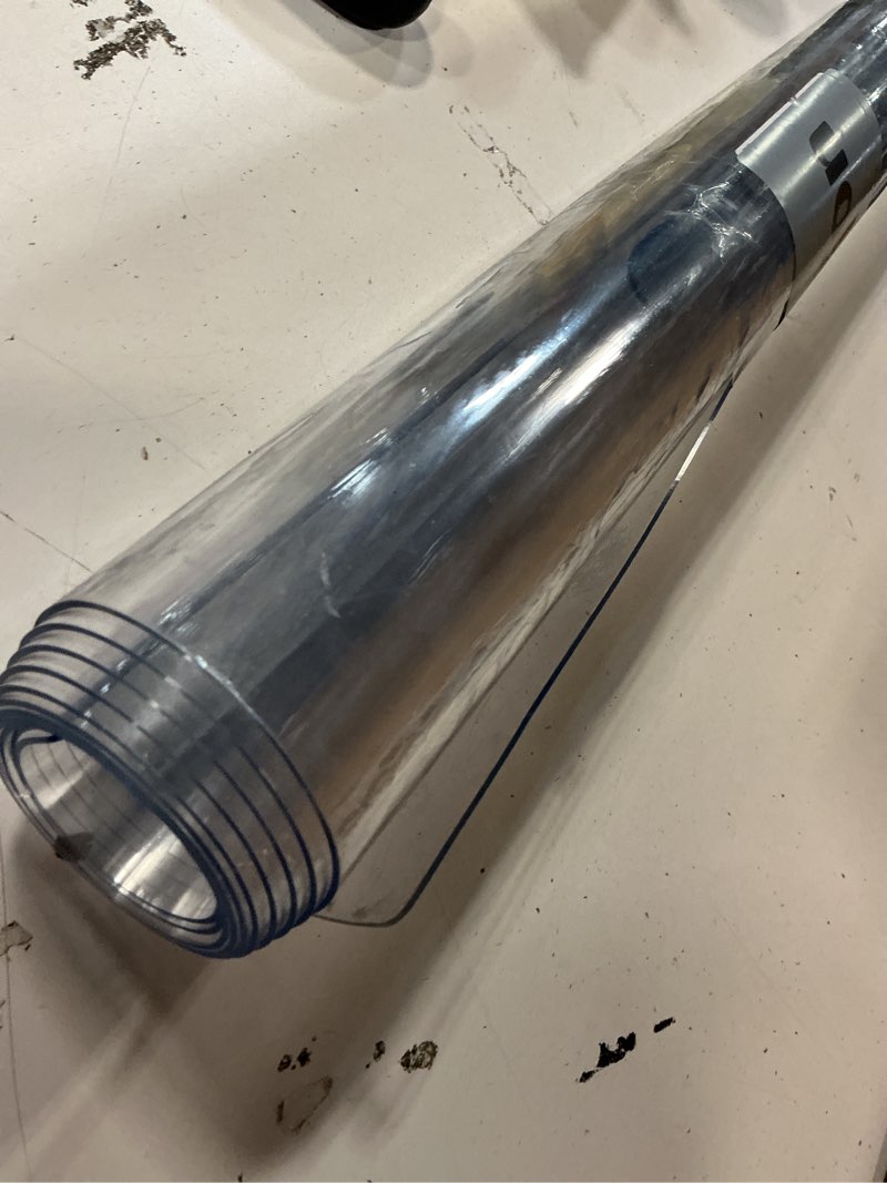 Condition photo showing As Is for LovePads Clear Desk Mat 23 x 47 Inch, 1.5mm Thick Clear Table Protector, Waterproof Plastic Table Cover Protector, PVC Desk Protector Mat, Vinyl Desk Cover for Desktop, Coffee & Dining Table 23" x 47" (Rectangular) Clear 1.5mm