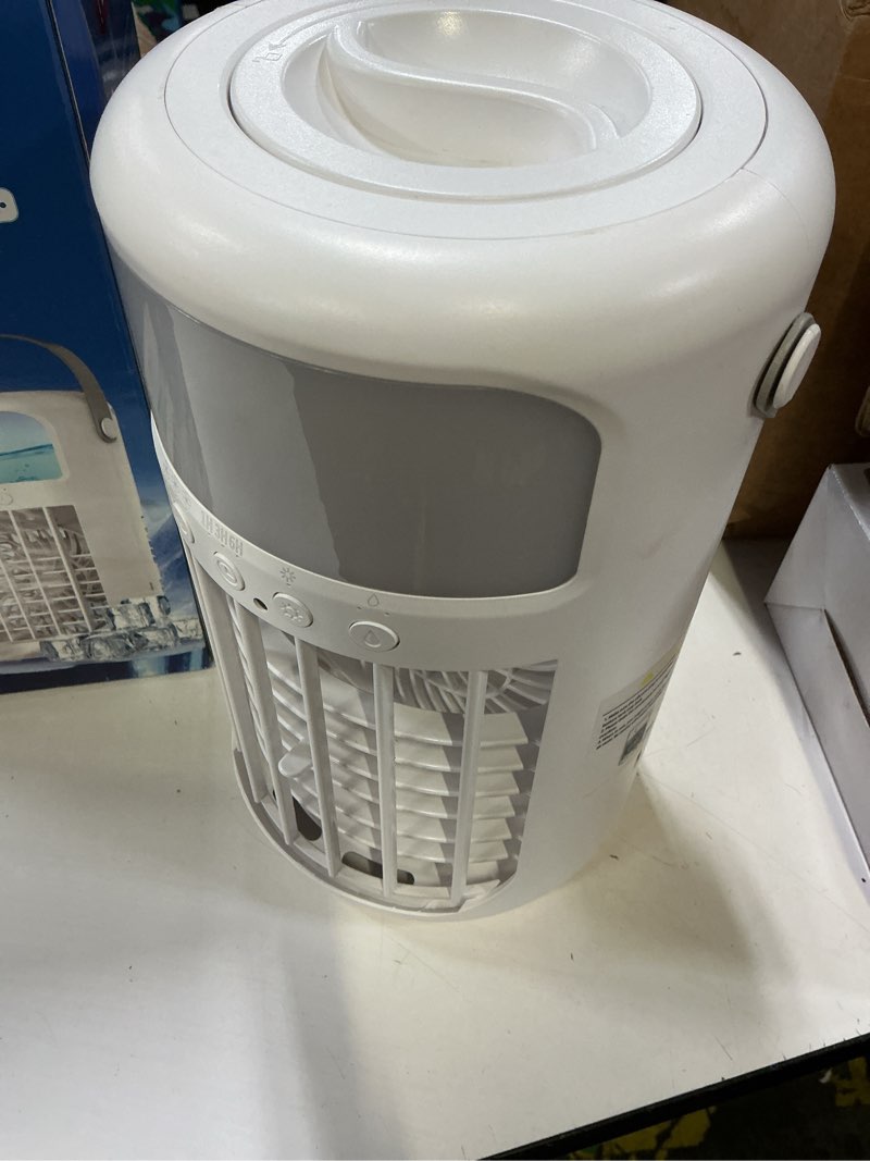 Condition photo showing As Is for portable air conditioner, 2026 upgraded 4-in-1 portable ice fan with 3 cooling speeds & 1500ml water tank, 2 cool mist ultra-quiet desktop ac fan with remote & 2-8h timer for bedroom, office, home white