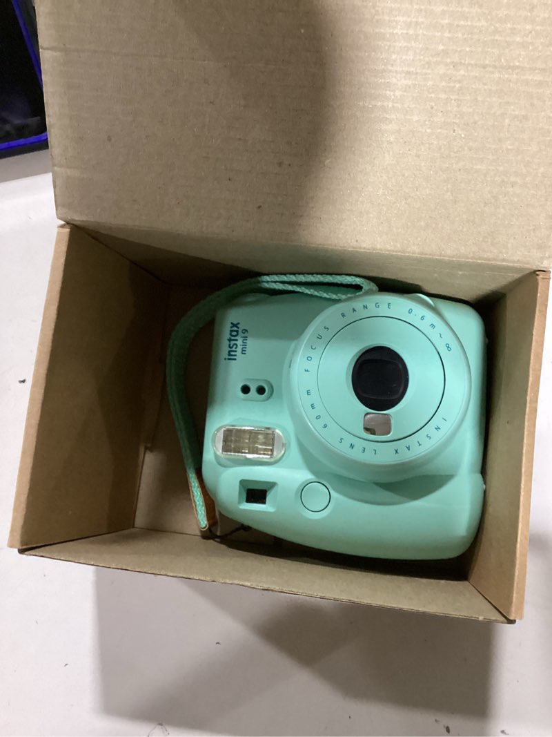 Condition photo showing New/Like New for Fujifilm Instax Mini 9 Instant Camera - Ice Blue, 2.7x4.7x4.6 (Instax Mini 9 - Ice Blue) Ice Blue Base