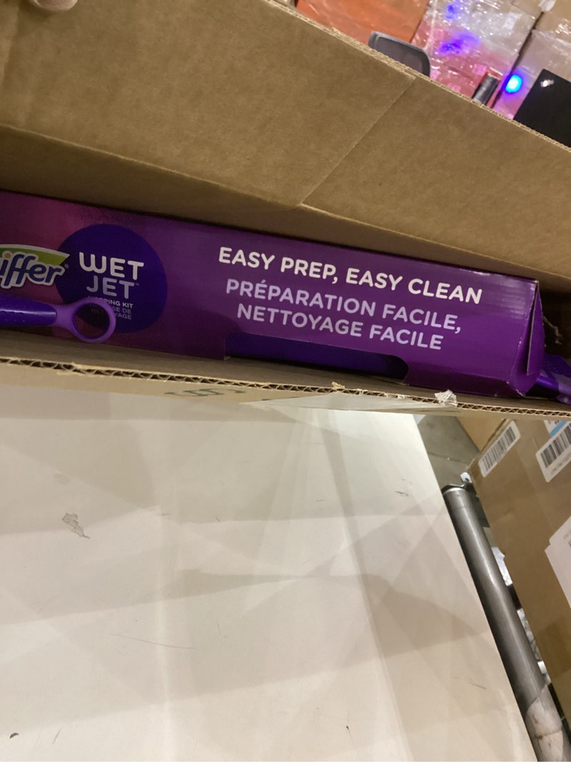 Condition photo showing New/Like New for Swiffer Wet Jet Mop, Floor Cleaner for Mopping Wood, Laminate, Tile in Home, Bathroom, Kitchen, All Purpose Multi-Surface Cleaning Set includes 1 Spray Mop, 5 Pads Refill, 1 Fresh Scent Solution Dust Mop