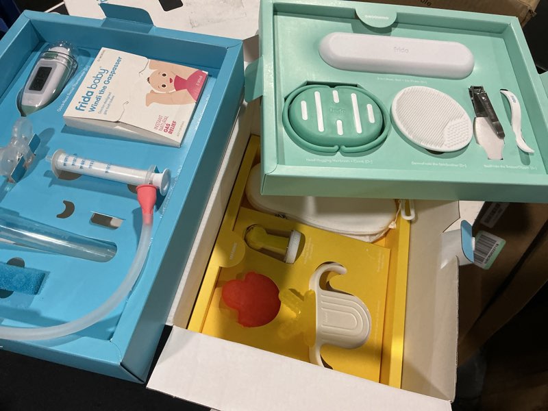 Condition photo showing Good Condition for frida baby ultimate baby kit, 10 piece new born essentials gift set includes wellness sick day, gas relief, grooming tools & teething toys