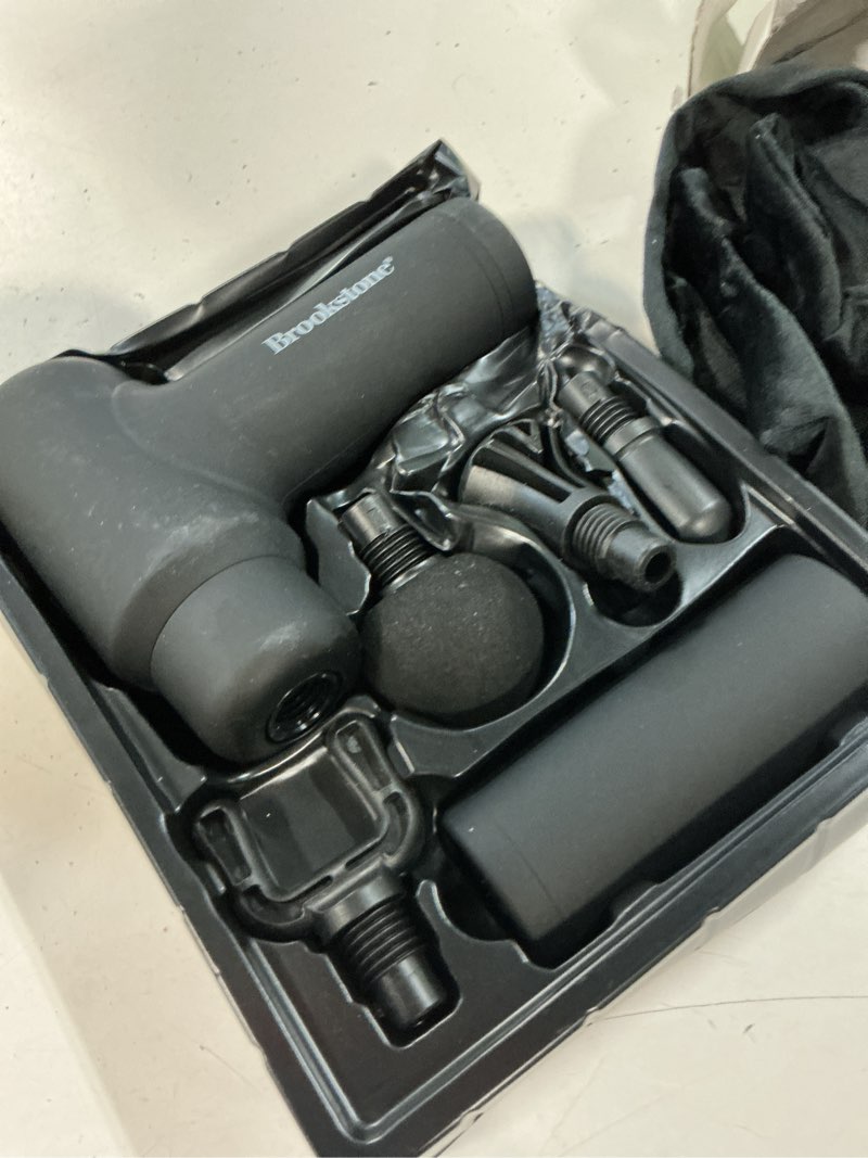 Condition photo showing As Is for brookstone deep tissue massage gun for pain relief & muscle recovery – 9-speed handheld percussion massager, 4 heads, type-c rechargeable, quiet, 3200 rpm, shockproof design