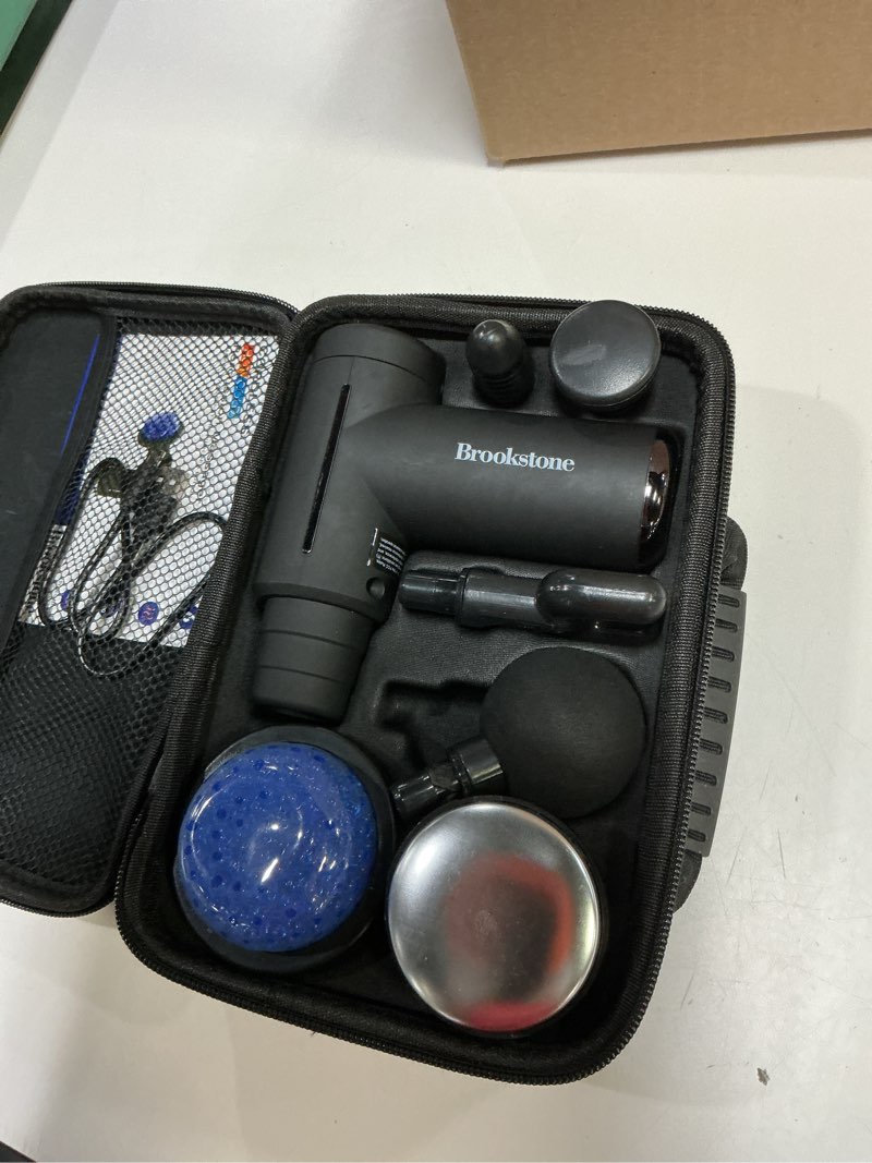 Condition photo showing As Is for brookstone cordless hot and cold percussion deep tissue massager gun, 6 intensity levels