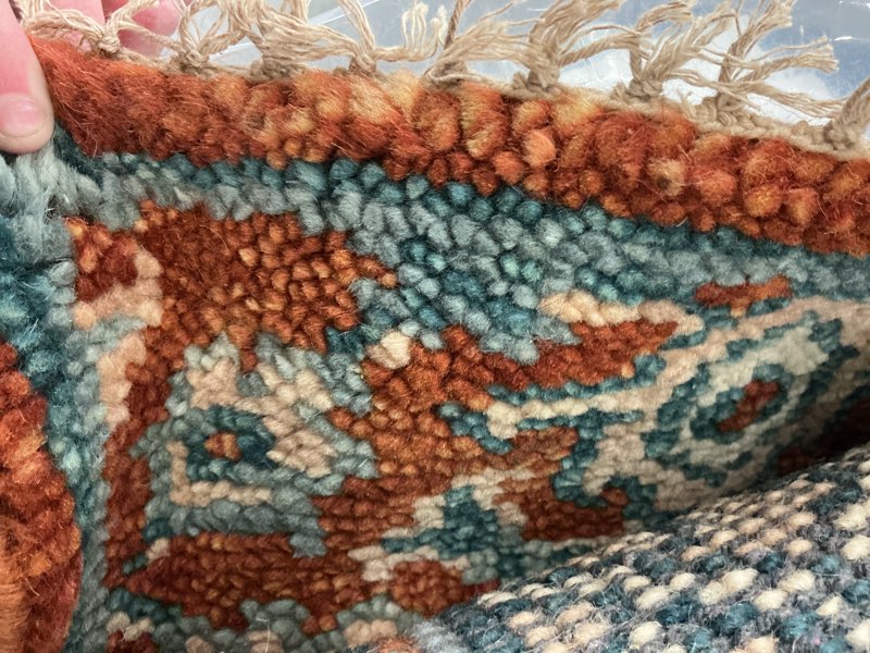 Orange amd blue multi colored rug 3’
