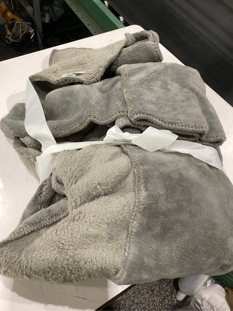 Condition photo showing Good Condition for ugg whitecap fleece throw blanket, soft fluffy blankets for couch or bed, home decor, luxury plush throw, machine washable, 50-inch x 70-inch, light grey seal throw grey