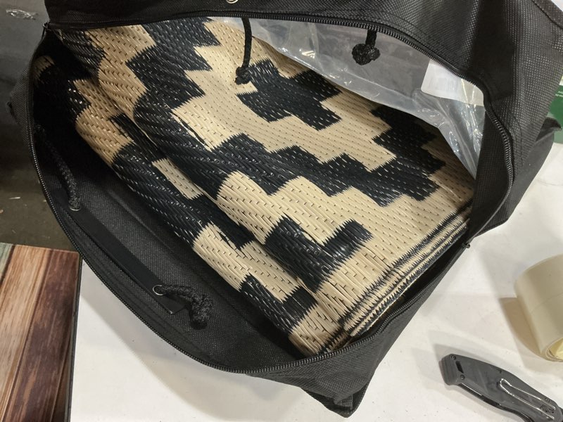 Condition photo showing Good Condition for smiry waterproof outdoor rug 5x8 ft, reversible plastic straw patio camping rugs, outdoor indoor rv mat carpet for patio, outside entry, backyard, deck, bench, picnic, camper, black & beige black and beige 5' x 8' (rectangular)