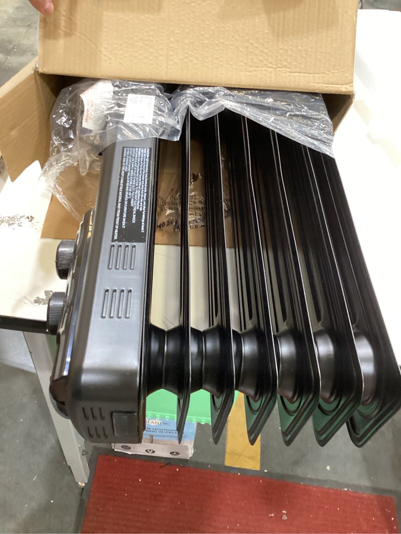 Condition photo showing As Is for utilitech up to 1500-watt oil-filled radiant utility indoor electric space heater with thermostat