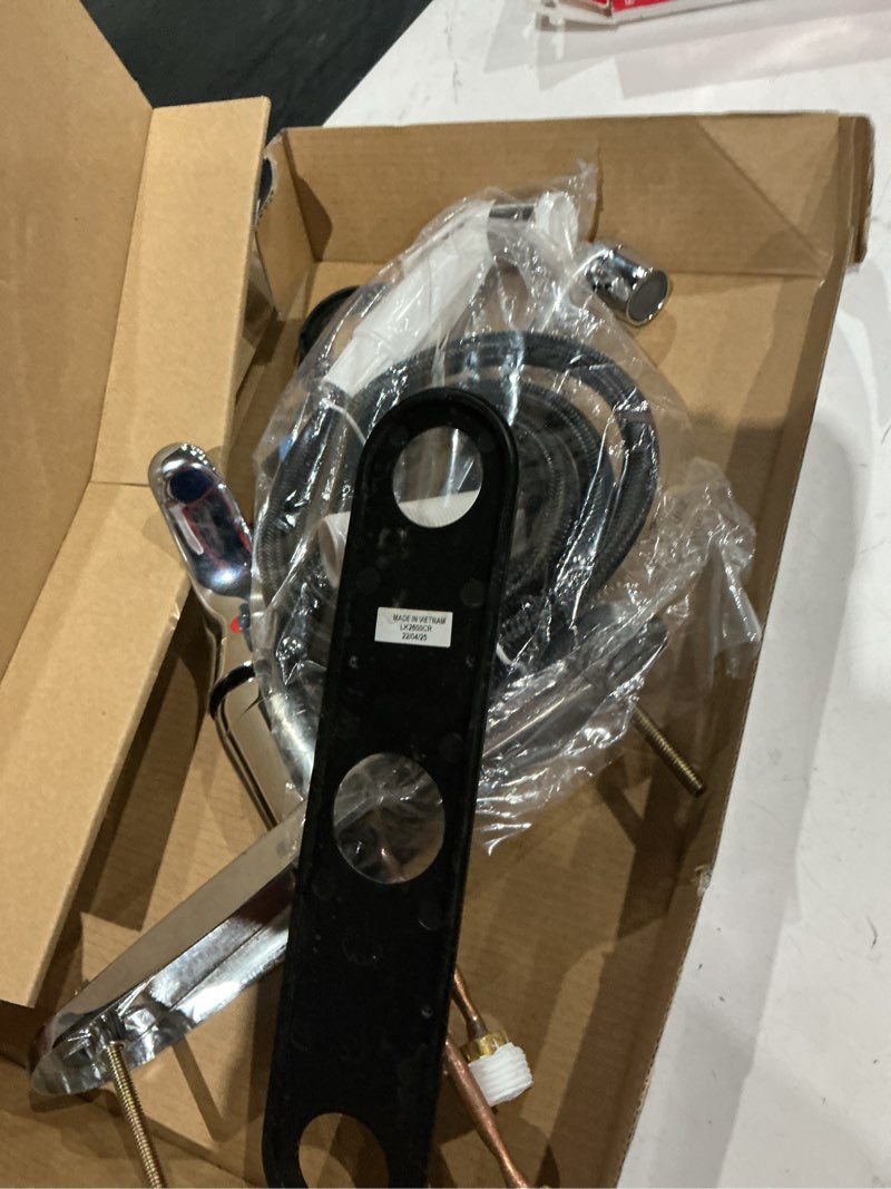 Condition photo showing As Is for project source wakebridge polished chrome single handle kitchen faucet (deck plate and side spray included)