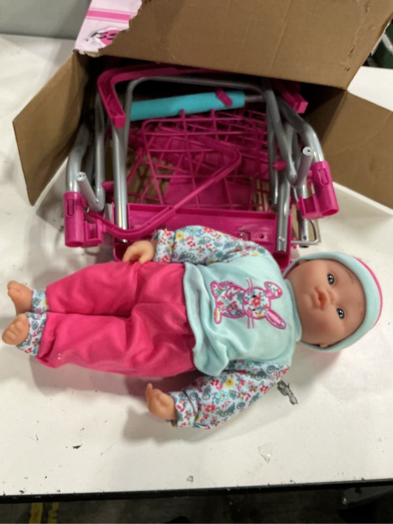 Condition photo showing As Is for shopping cart with 16" baby doll