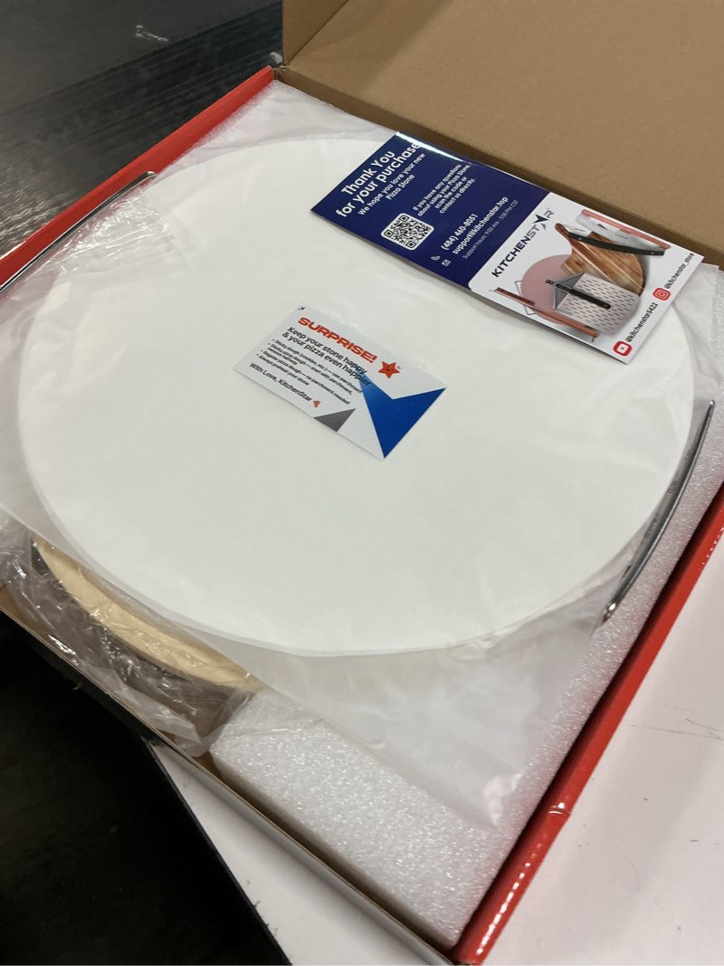 Condition photo showing New/Like New for KitchenStar 14-inch Pizza Stone for Oven and BBQ Grill with Handles, Round, 5/8" Thick - Natural Cordierite, 1800 °F Resistant, Baking Stone Set with Stainless Steel Rack & Plastic Scraper Tool 14 inch